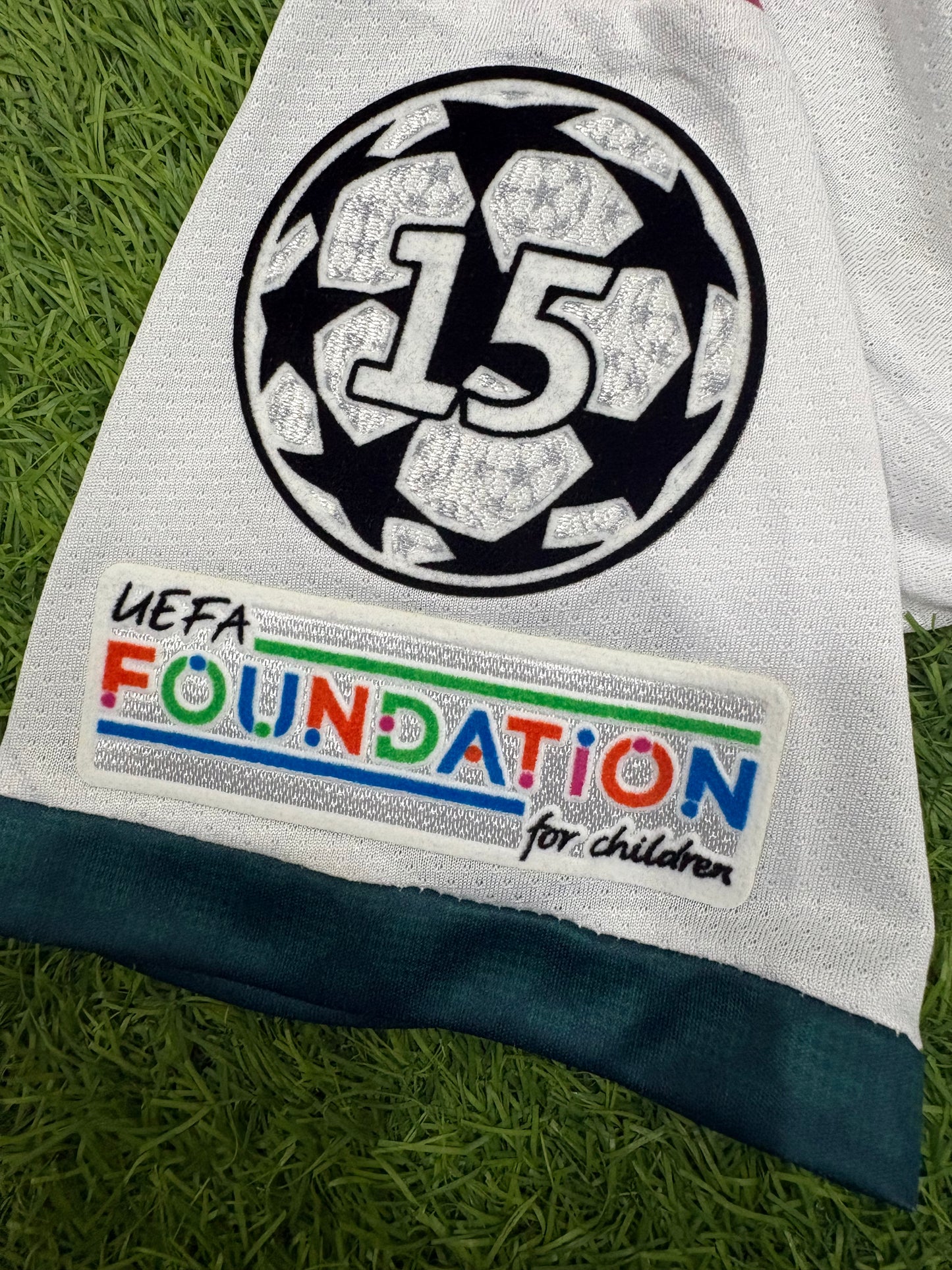 Real Madrid Home 26/27 Player version logos (Half sleeves)